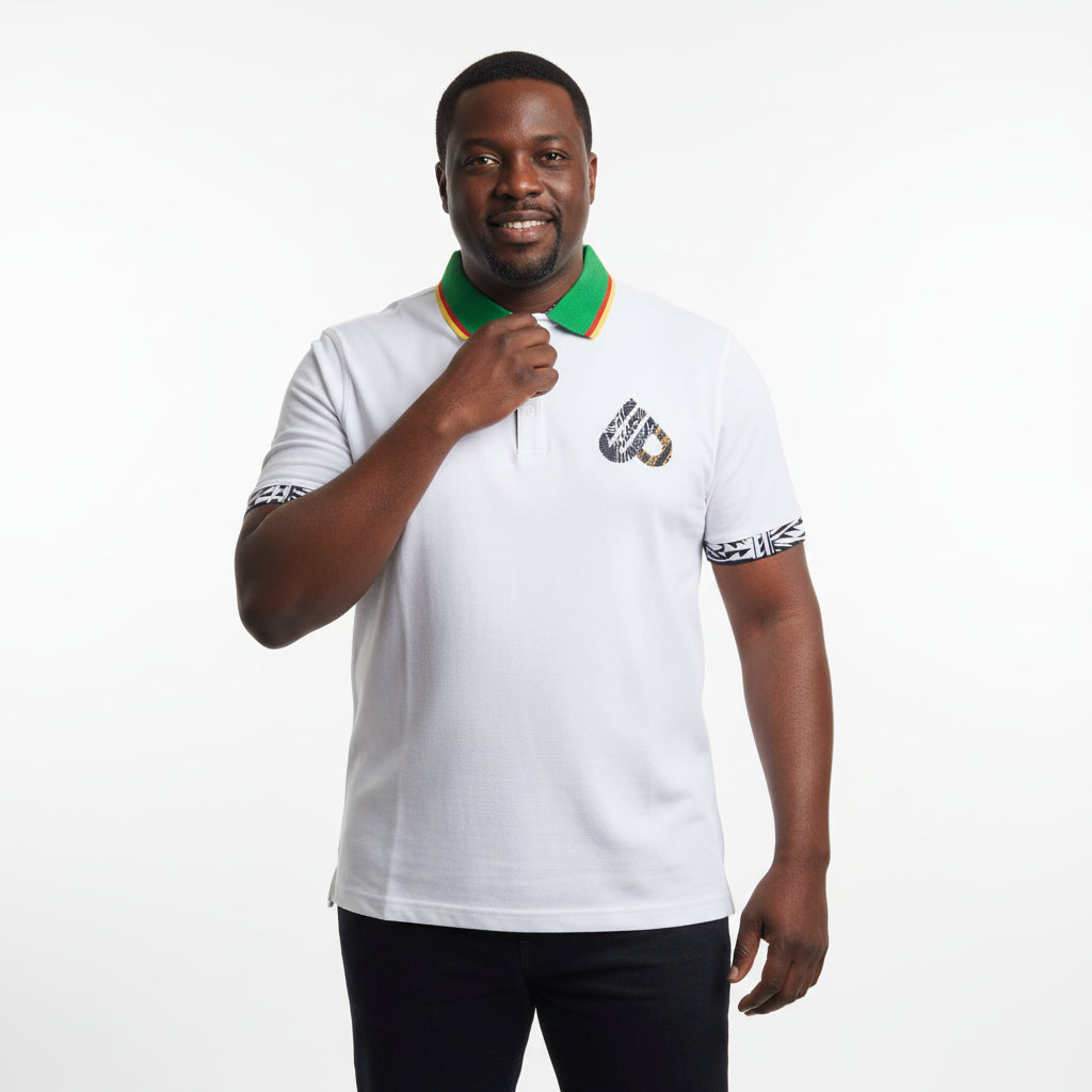 Man wearing a white polo shirt with a logo on a white background